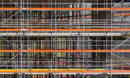 Construction theme showing a full frame scaffolding structureの写真素材