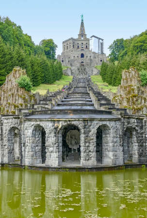 The Hercules monument with cascades and Plutogrotto at the Bergpark Wilhelmshoehe in Kassel, Germany