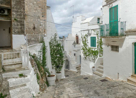 Idyllic alleyway in Ostuni, a city in Apulia, Italyの写真素材