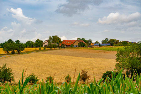 Idyllic farmland scenery around a small village in Hohenlohe, an area in Southern Germany at late...