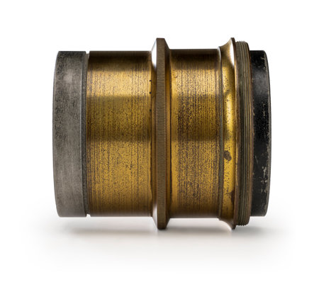 Sideways shot of a historic camera lens in white backの写真素材