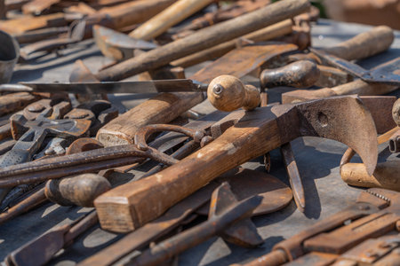 Lots of various old used tools in sunny ambianceの写真素材