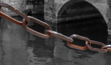 Rusty chain closeup seen at Riva del Garda located at Lake Garda in Northern Italy