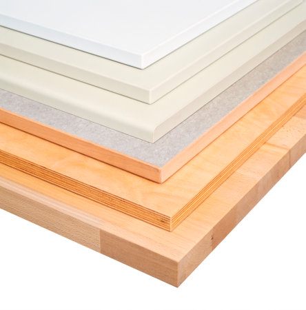 Edge of various stacked boards in white backの写真素材