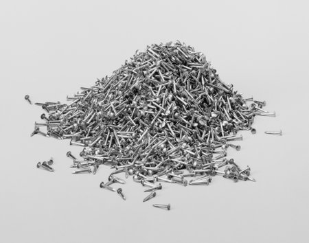 Pile of small metallic nails in light backの写真素材