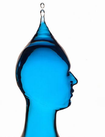 AI generated image showing a translucent liquid blue human head with drop in white backの素材