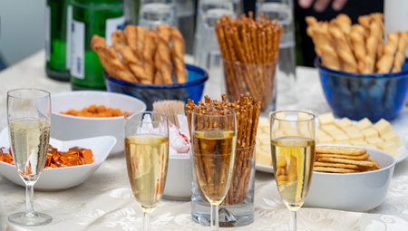 Reception closeup scenery showing lasses with sparkling wine and some salty snacksの写真素材