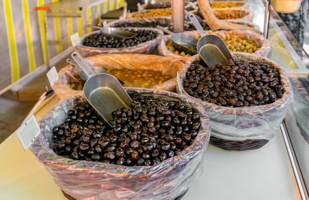 Various pots with marinated olives seen at a market stall in southern France