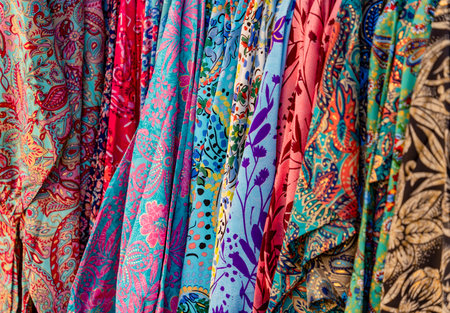Full frame closeup shot showing a display of various colorful fabrics