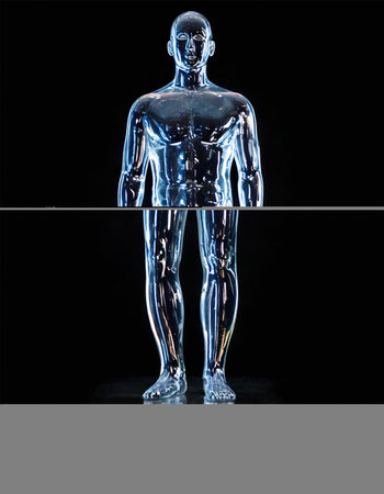 AI generated image showing a glossy translucent male human sculpture in dark backの素材