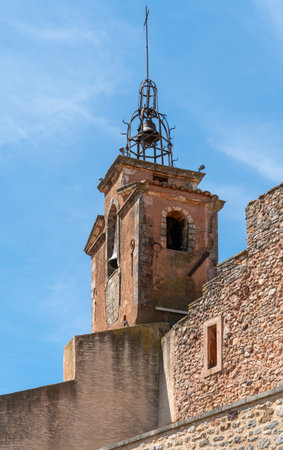 Bell tower seen in Roussillon, a commune in the Vaucluse department of the Provence region in southern Franceの写真素材