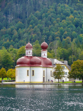 St. Bartholomews Church at a lake named Koenigssee located in the Berchtesgadener Land in Bavaria (Germany) at summer timeの写真素材