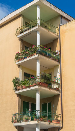 balconies at the edge of a house seen in Porto Maurizio in Oneglia, a former town in northern Italy on the Ligurian coast, in 1923 joined to Porto Maurizio to form the Comune of Imperia.の写真素材