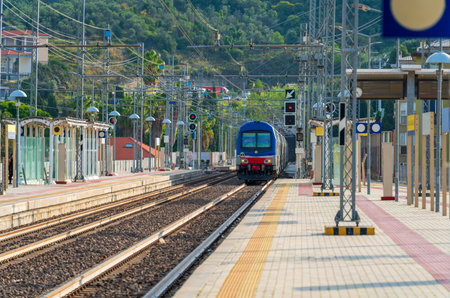 Railway station with train in Imperia, a city in Liguria, northern Italyの写真素材