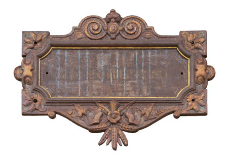 Historic rusty cast iron plate isolated in white backの写真素材