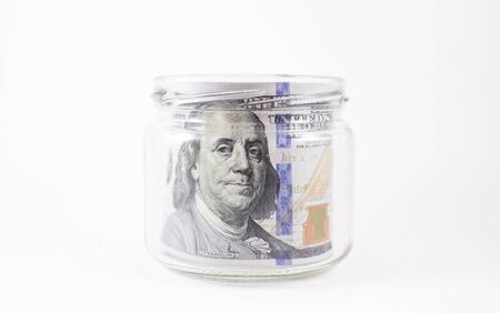 Dollar banknotes in a jarの写真素材