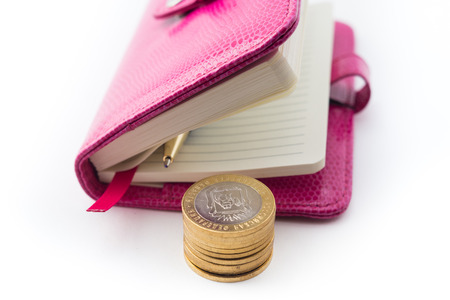 notebook, pen and coinsの写真素材