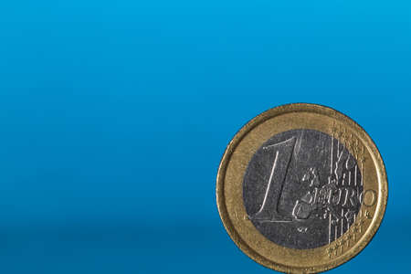 one euro on blue background