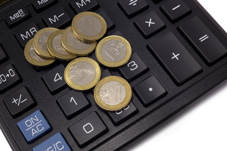 calculator with coinsの写真素材