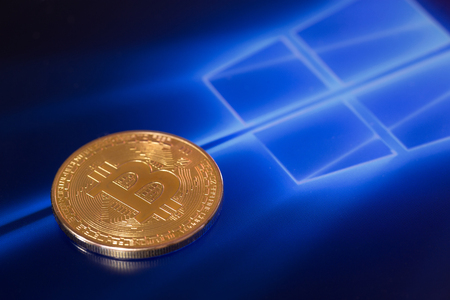 bitcoin and windows background. Windows is a operating systems developed, marketed, and sold by Microsoft. Ufa, Russia - May 16, 2017のeditorial素材