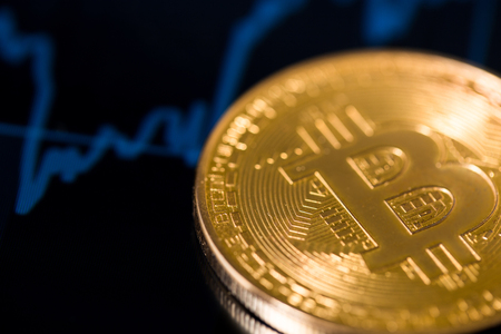 shiny bitcoin with chart