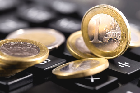 Euro coins on calculatorの写真素材