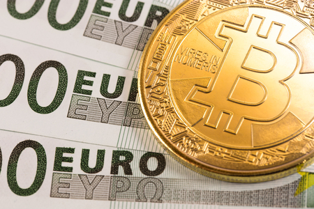 bitcoin and euro banknotesの写真素材