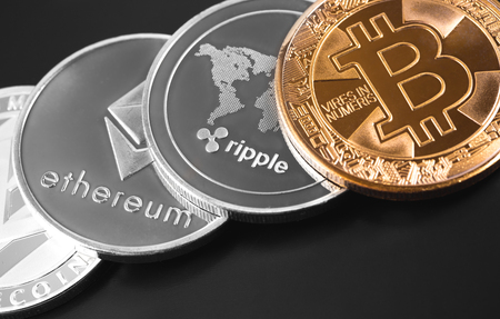 bitcoin, ethereum, ripple and litecoin on the black backgroundの写真素材