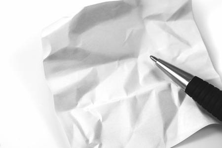 crumpled note paper with penの写真素材