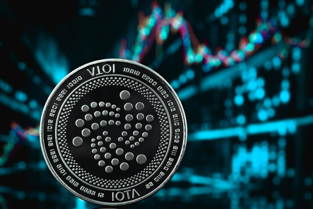 iota coin cryptocurrency on the chart backgroundの写真素材