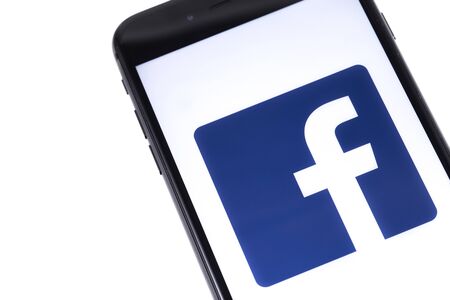 Apple iPhone and Facebook logo. Facebook is largest and most popular social networking site in the world. Ekaterinburg, Russia - March 22, 2018のeditorial素材