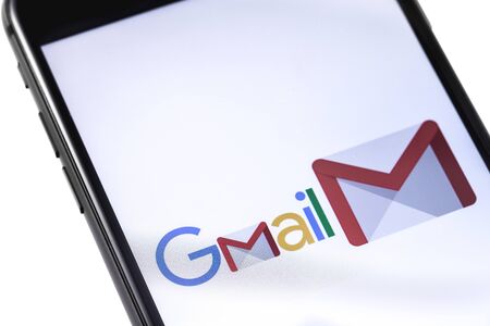 Apple iPhone with Gmail logo on the white background. Russia - October 04, 2018
