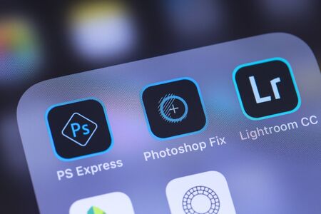 Adobe Inc. mobile apps icon on the screen smartphone. Adobe Systems Incorporated is an American multinational computer software company. Moscow, Russia - October 27, 2018のeditorial素材