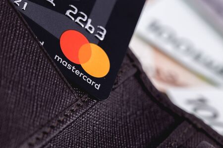 Master Card in the leather wallet, close up of credit cards. MasterCard Worldwide is an American multinational financial services corporation. Moscow, Russia - December 8, 2018のeditorial素材