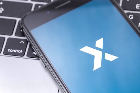 Poloniex app on the screen smartphone and notebook. Poloniex - one of the largest cryptocurrency exchange on the market. Moscow, Russia - December 4, 2018のeditorial素材