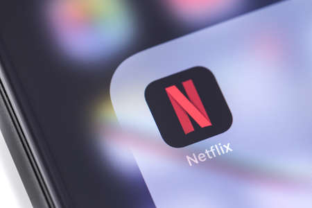 Netflix icon app on the screen smartphone. Netflix is an international leading subscription service for watching TV episodes and movies. Moscow, Russia - February 28, 2019のeditorial素材