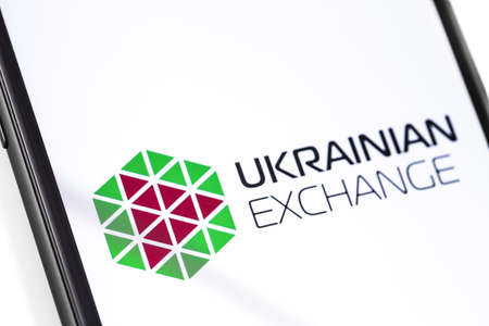 closeup smartphone with Ukrainian Exchange logo on the screen. Ukrainian Stock Exchange. Moscow, Russia - March 17, 2019のeditorial素材