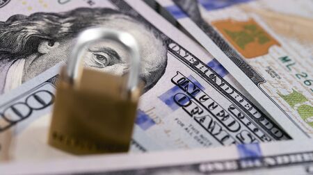 protection money, dollars and lock