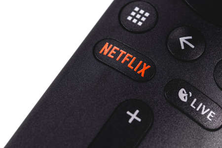 Netflix button on the remote controller closeup. Netflix is an international leading subscription service for watching TV episodes and movies. Moscow, Russia - April 19, 2019のeditorial素材