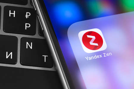 Closeup Yandex Zen icon app on the screen smartphone. Yandex Zen is service of Yandex personal...