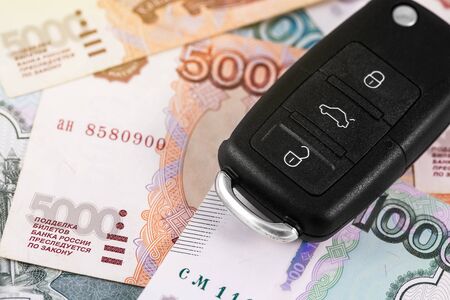closeup car key on russian rubles banknotes