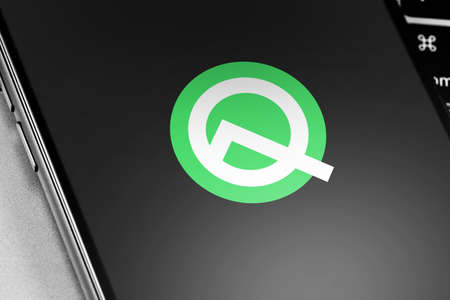 smartphone with Android Q logo on the screen. Google Android is the operating system for smartphones, tablet computers, e-books, game consoles, and other devices. Moscow, Russia - May 20, 2019のeditorial素材