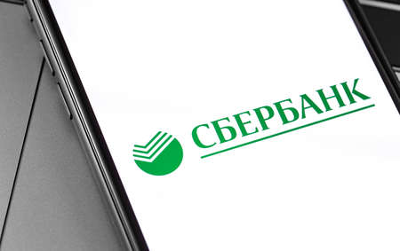 Sberbank logo on the display smartphone. Sberbank - Russian financial conglomerate, the largest...