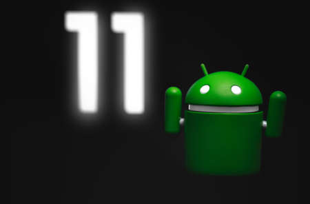 Google Android figure show Android 11 version on screen in the dark. Google Android is the operating system for smartphones, tablet computers, e-books, game consoles, and other devices. Moscow, Russia - December 18, 2019のeditorial素材