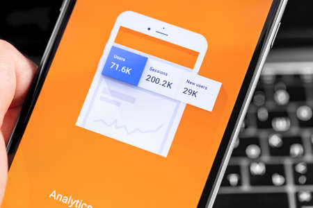 Google Analytics app on the screen smartphone closeup. Google Analytics is a free service provided by Google to create detailed statistics on website visitors. Moscow, Russia - December 12, 2019のeditorial素材