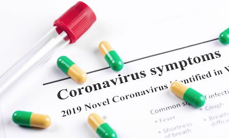 pharmaceuticals antibiotics capsule pills and glass tube closeup on the work paper background, medicineの写真素材