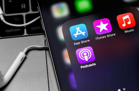 App Store, Apple Music, iTunes Store, Podcasts icon apps on the screen iPhone. Apple Music is a...