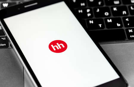 HeadHunter mobile app on the screen smartphone closeup. HeadHunter - the largest Russian Internet recruitment company. Moscow, Russia - March 24, 2020のeditorial素材