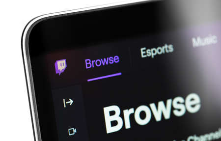 Twitch website or app on the screen notebook closeup. Twitch is a video streaming service specializing in computer games. Moscow, Russia - March 24, 2020のeditorial素材