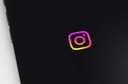 Instagram logo on the screen smartphone closeup. Instagram is a photo-sharing app for smartphones....